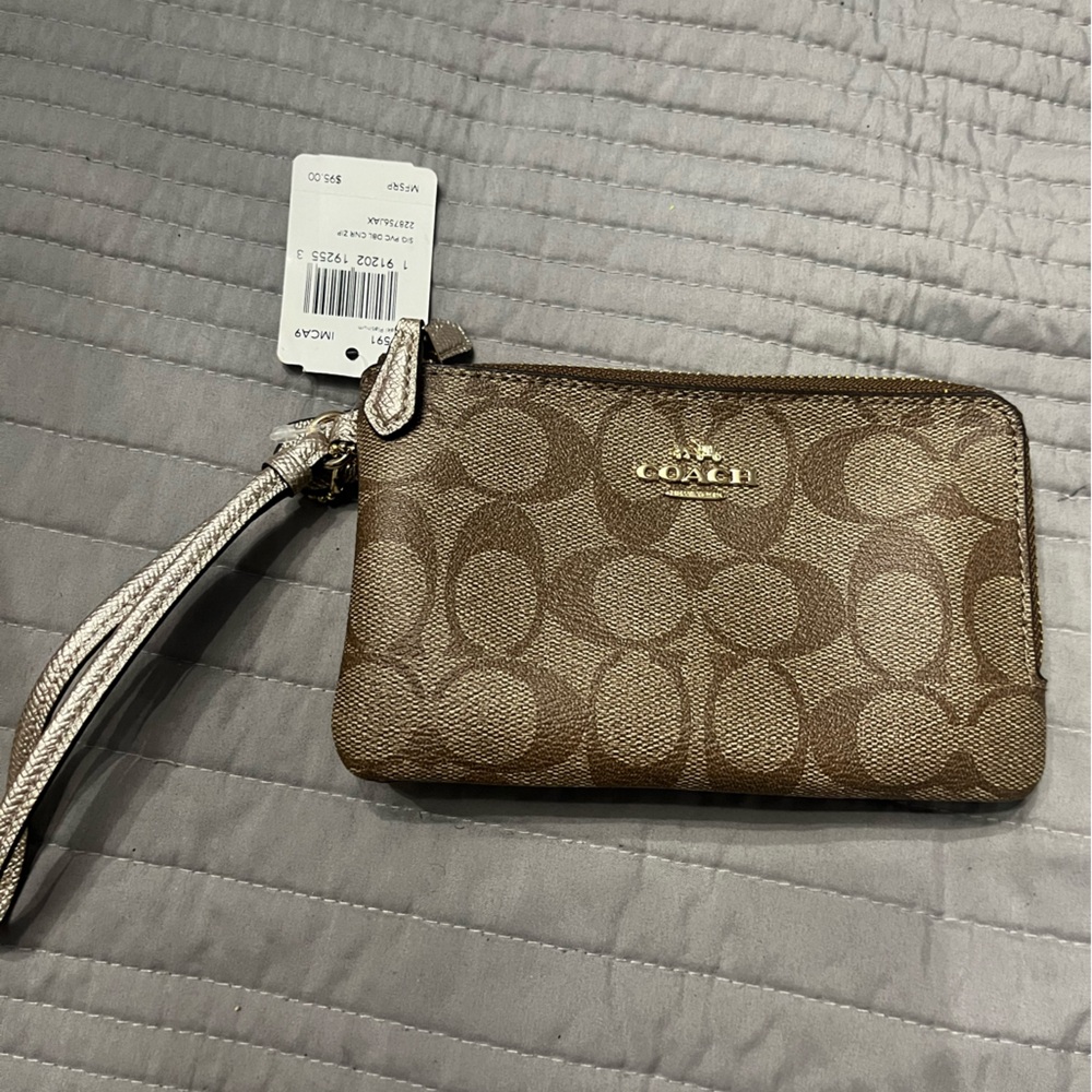 Coach khaki and platinum signature wristlet